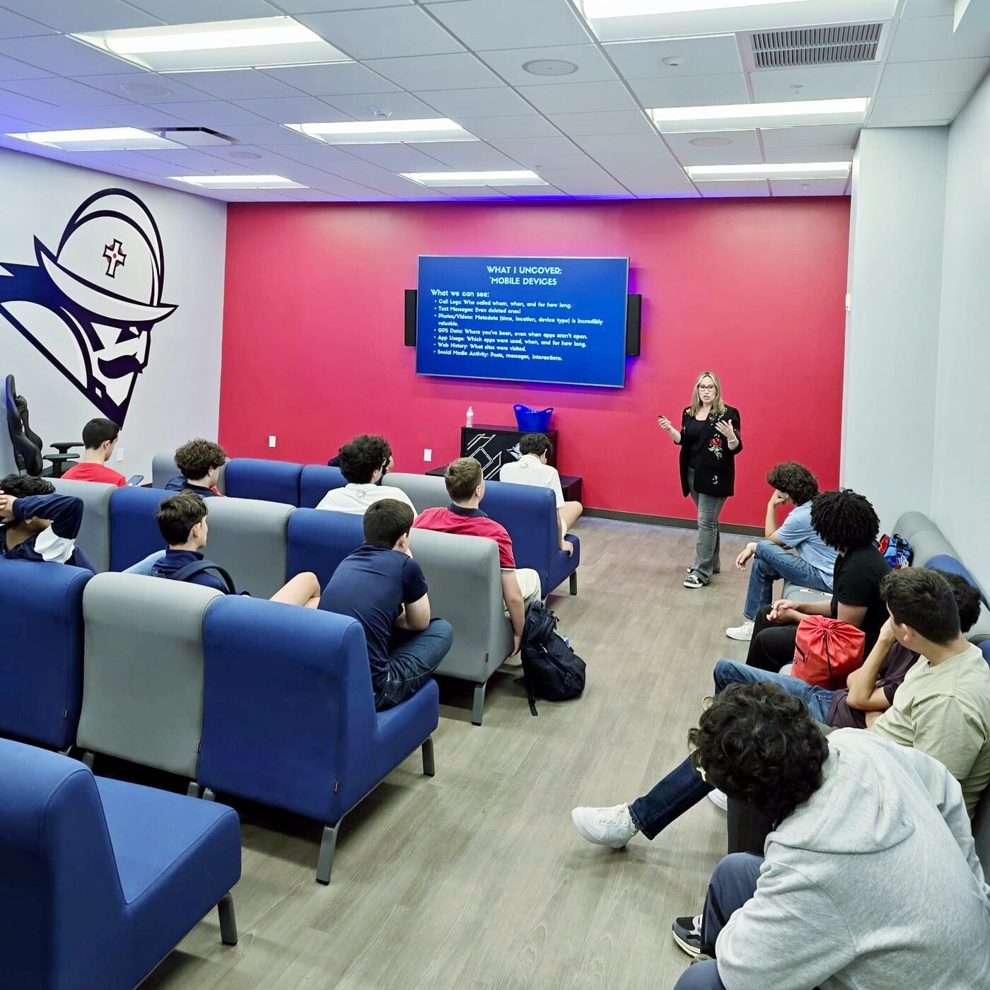 Jovianna Gonzalez presenting to a room of students on what mobile device forensics can uncover